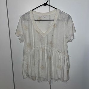 White peplum shirt with beige embroidery